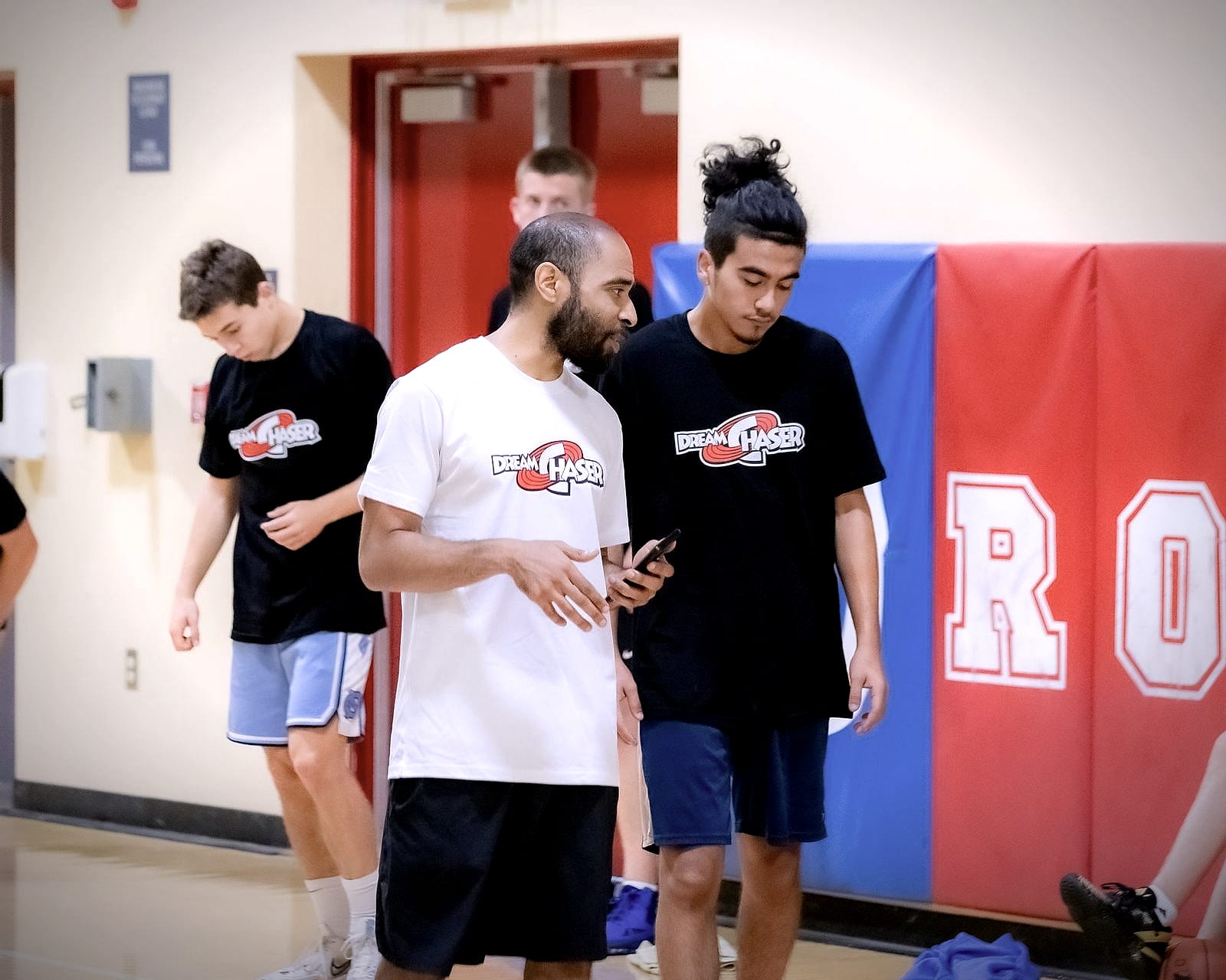 Coach Jelani Hicks coaching a Dream Chaser athlete during a training session
