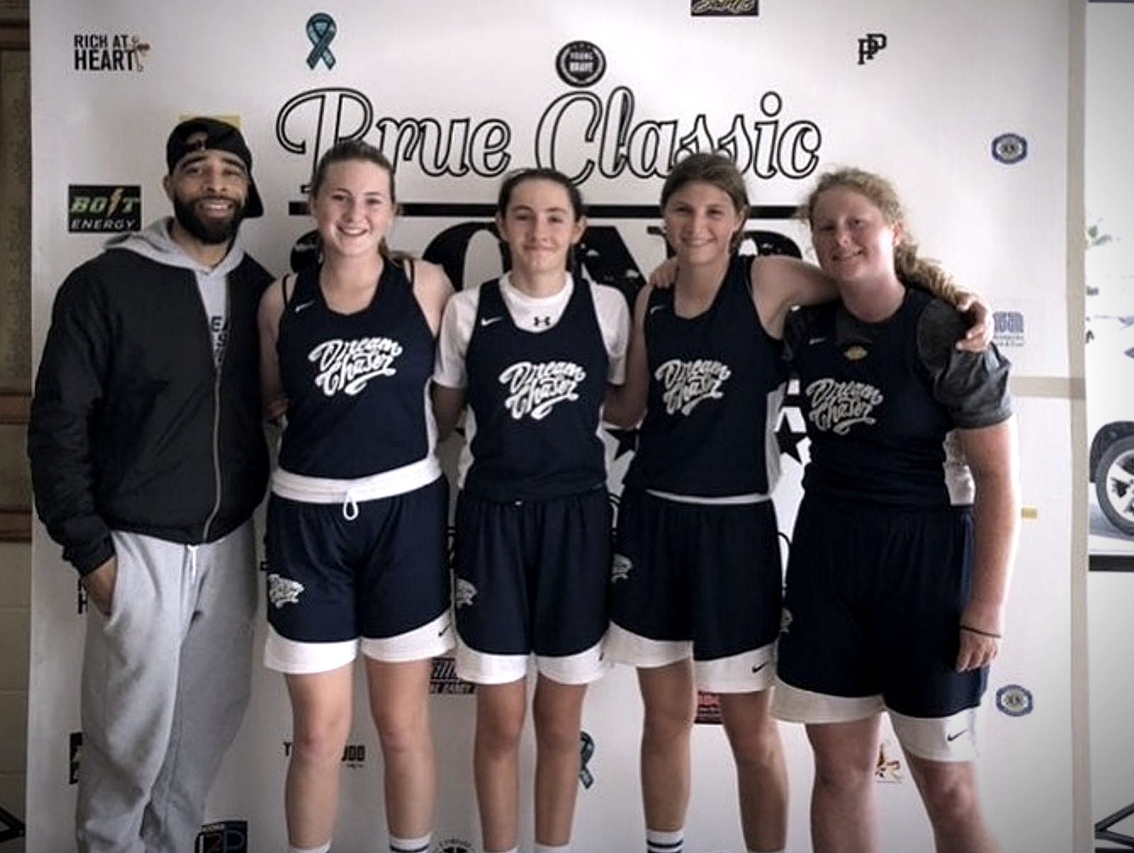 Coach Jelani with Dream Chaser Skills Academy players at a tournament